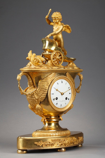Empire period clock with a putto in a chariot
