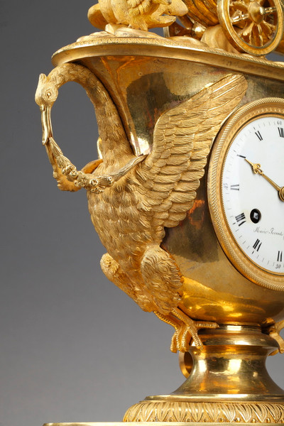 Empire period clock with a putto in a chariot