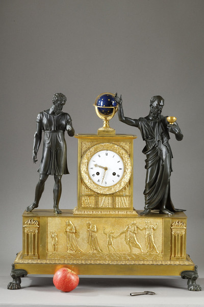 Empire style clock adorned with two mythological figures