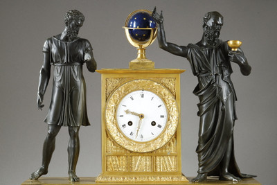 Antique decorative clock depicting a scene from Greek mythology