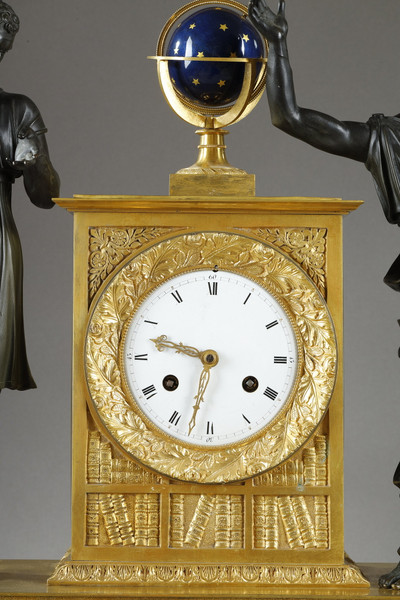 A carved clock featuring two figures of antique characters