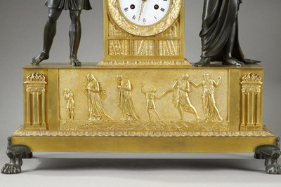 Sculpted composition adorning an antique clock