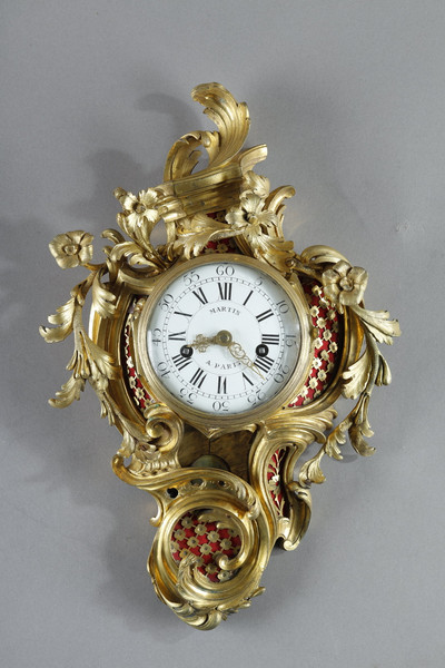 Cartel d'applique Louis XV en bronze doré.