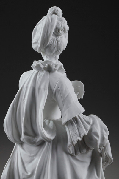Statue of a woman in a French-style dress