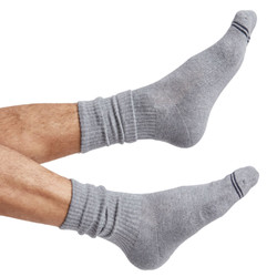 one pair of grey casual crew socks with two accents on the toe shown on foot. one pair of grey casual crew socks with two accents on the toe shown on foot.