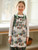Caroling Oilcloth Kid's Apron - Winter