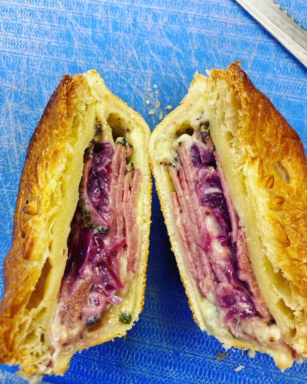 Reuben Pie with Beef Pastrami, Swiss cheese, mustard sauce and ruby Sauerkraut