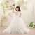 QueenLine Long Trailing Flower Girl Dresses for Wedding Beading Lace White Holy Communion Dress Backless Kids Pageant Dress for Birthday