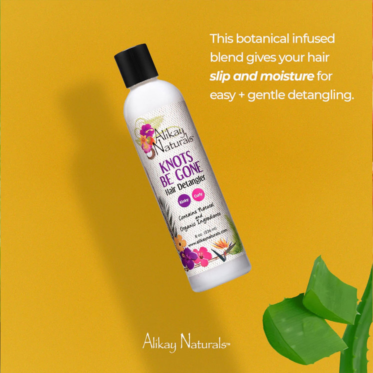 Detangling natural curly hair with Alikay Naturals Knots Be Gone spray, reducing knots and breakage