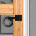 Kwikset Milan Passage Lever, Square Rose With 6-Way Adjustable Latch And Round Corner Strike, Matte Black