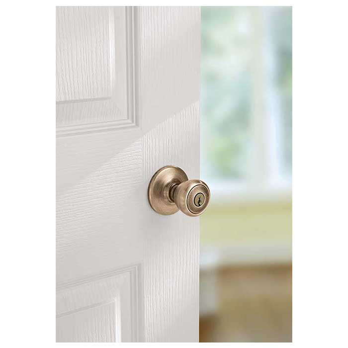 Kwikset Tylo Keyed Entry Knob Smartkey With 6-Way Adjustable Latch And Round Corner Strike, Antique Brass