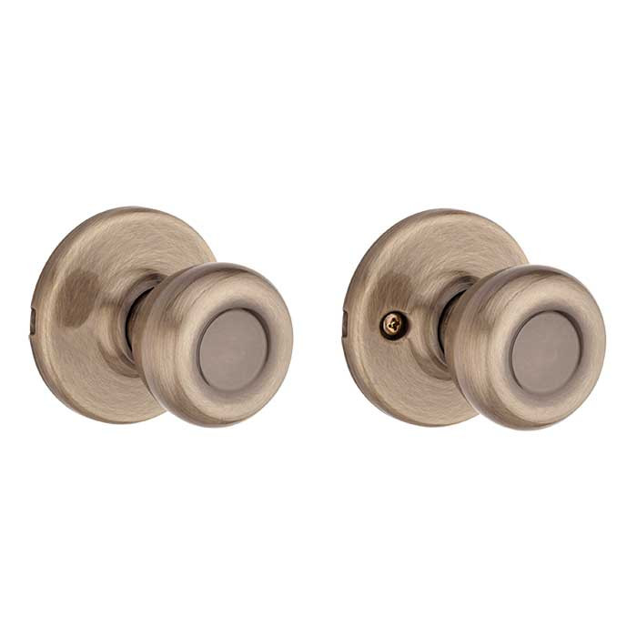 Kwikset Tylo Passage Knob With 6-Way Adjustable Latch And Round Corner Strike, Antique Brass