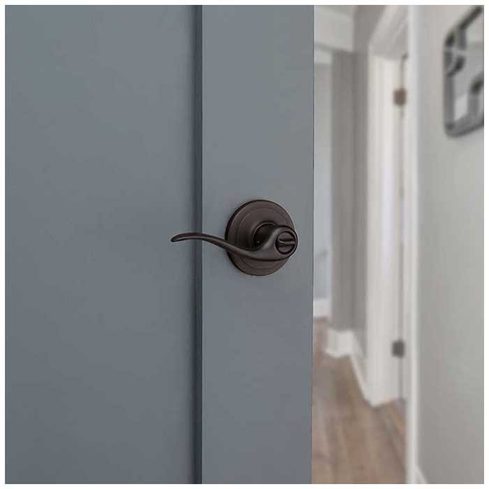 Kwikset Tustin Privacy Lever With 6-Way Adjustable Latch And Round Corner Strike, Venetian Bronze
