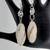 White jade gemstone earrings that promote peace and loving energy