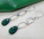 Handmade Emerald Shimmer Dangle Earrings by Jiana Deon — pear-shaped Swarovski crystal with oval link accents.