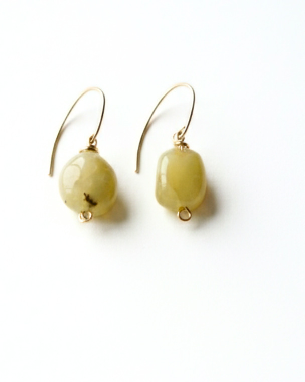 Buttercup drop on white background. Handmade by Jiana Deon.  Earrings for women