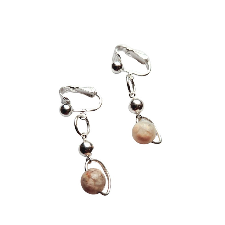 Floating Agate Clip-On Earrings in tan and white with gold-plated frame by Jiana Deon