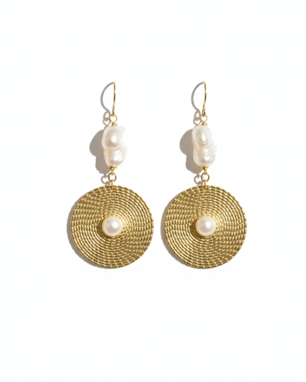 IV Ivory Halo earrings by Jiana Deon showcase organic ivory pearls suspended above textured gold discs. Designed for Spring / Summer 2026, this design balances