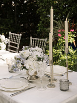 Wedding reception table with silver candlesticks