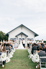Wedding party with beautiful floral arrangements