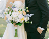 Wedding party with beautiful floral arrangements