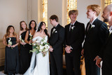 Bridal party holding Zayah Collection bouquets