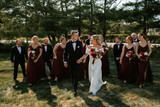Bridal party holding bouquets from the Stella Collection