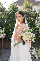 Bride holding Lucy Collection flowers