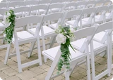 Eucalyptus aisle markers with white peonies and Queen Anne's Lace