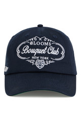 Navy Bouquet Club baseball cap with white embroidered "Blooms Bouquet Club New York" logo on the front.