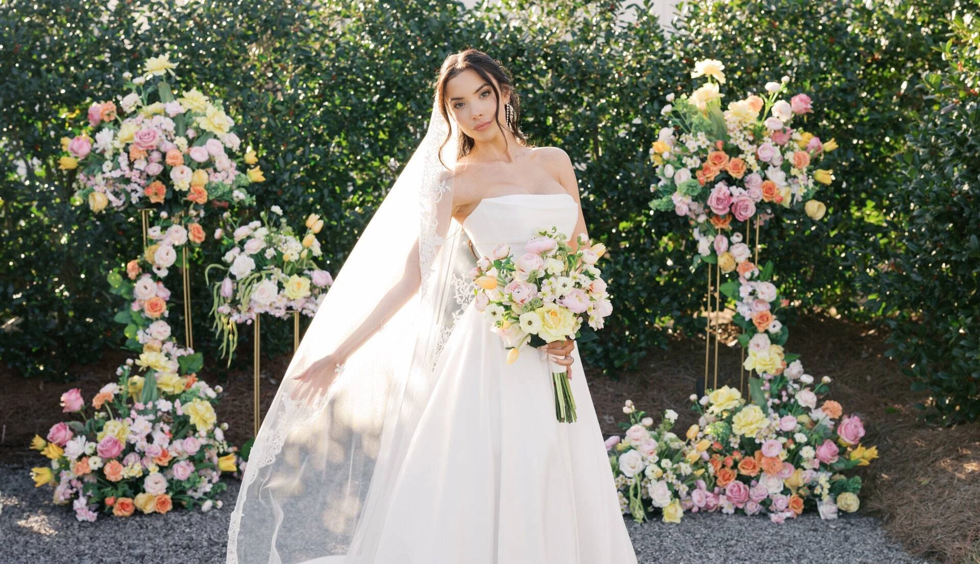 Bridesmaid holding silk flowers from Something Borrowed Blooms