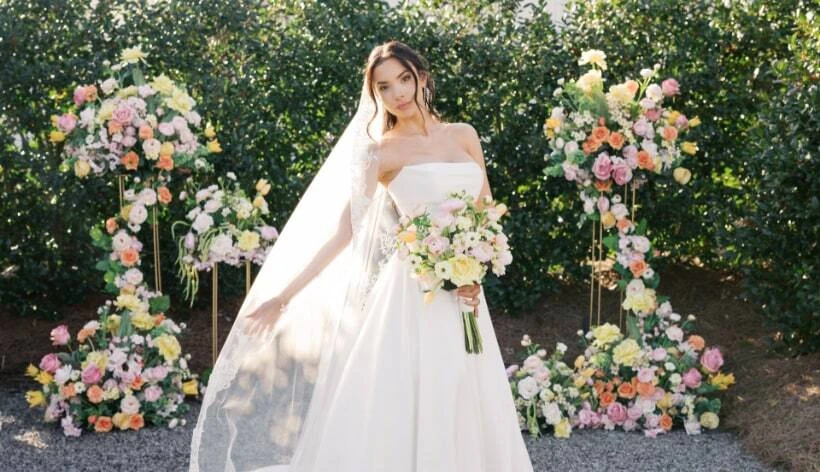 Bridesmaid holding silk flowers from Something Borrowed Blooms