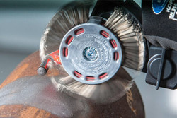 The bristle tips are designed to strike the corroded surface with kinetic energy that is equivalent to standard processes that use grit blast media.