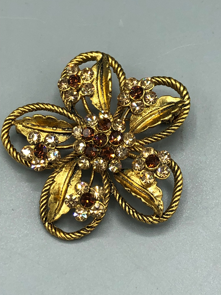 Gold tone  crystal flower brooch