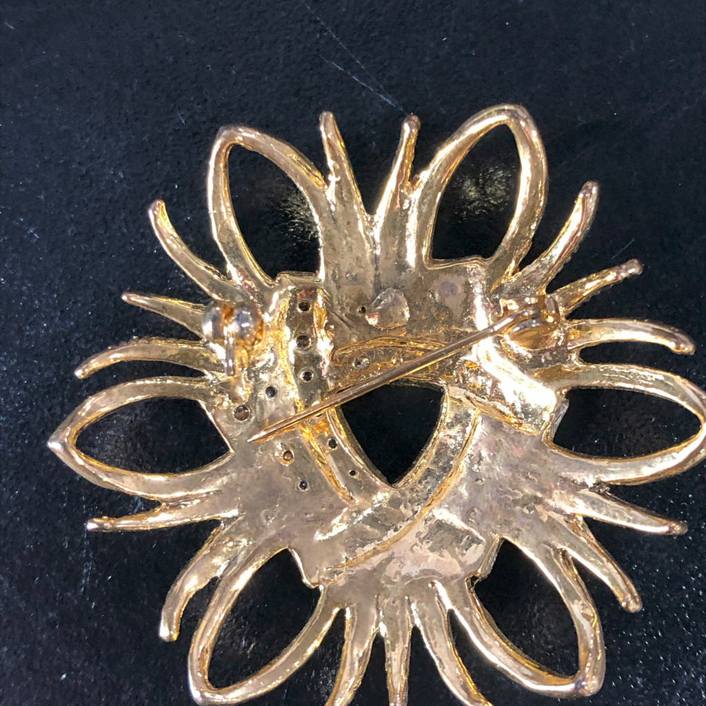 Gold tone crystal brooch