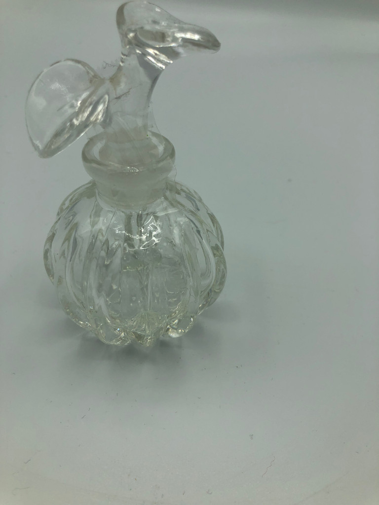 Glass perfume bottle with flower stopper