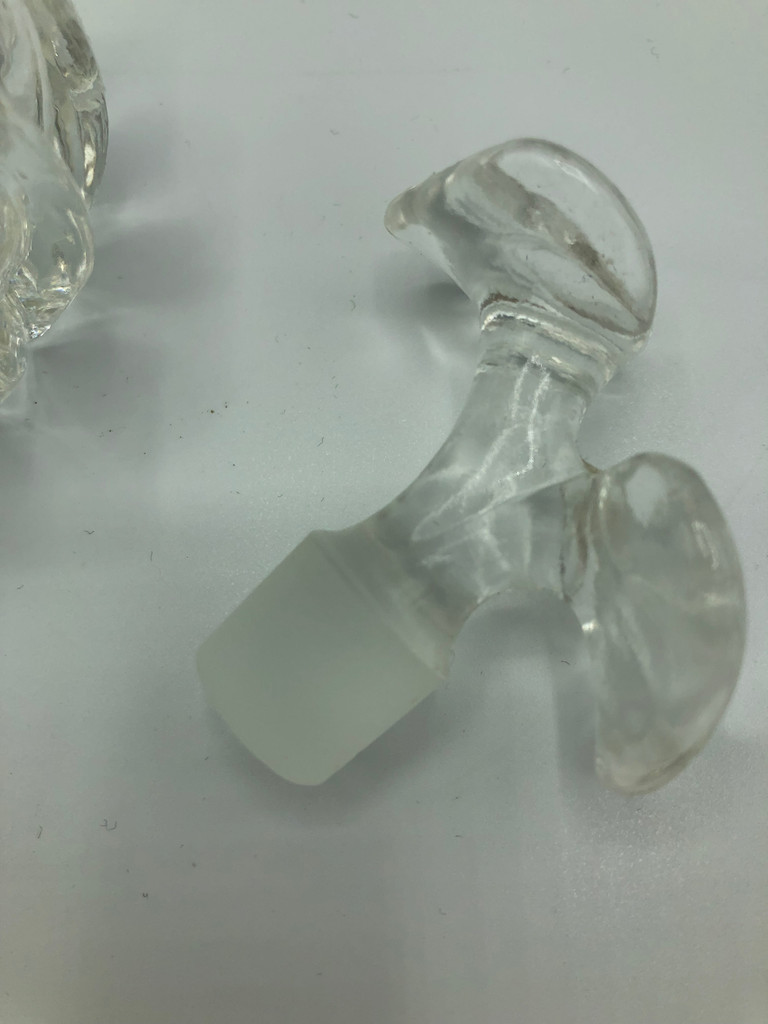 Glass perfume bottle with flower stopper