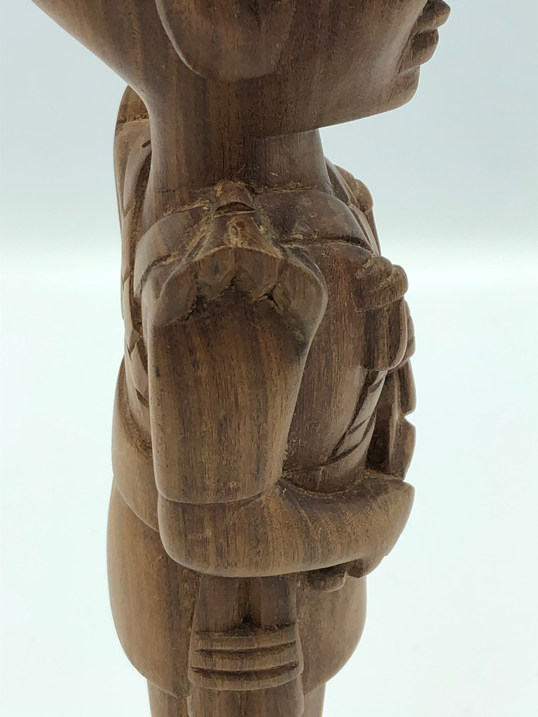 Wood hand carved man playing drum