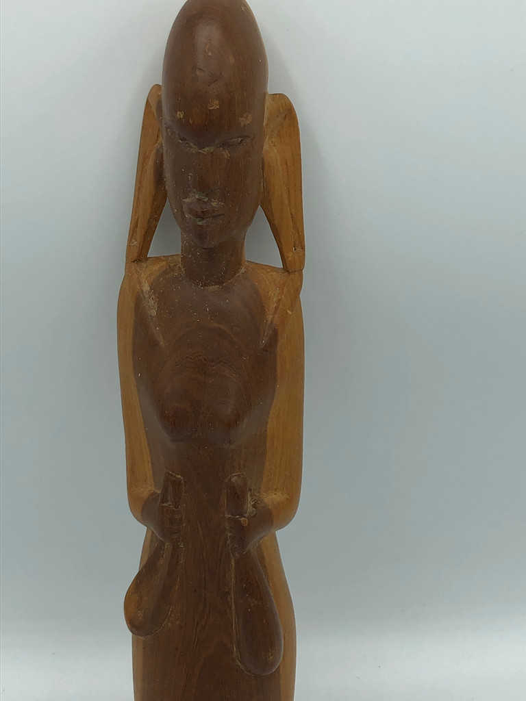 Carved wooden women figurine