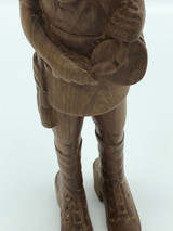 Wood hand carved man playing drum
