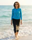 Model wearing style 2636 zippered skirted capri with style 2637 zippered swim top in teal