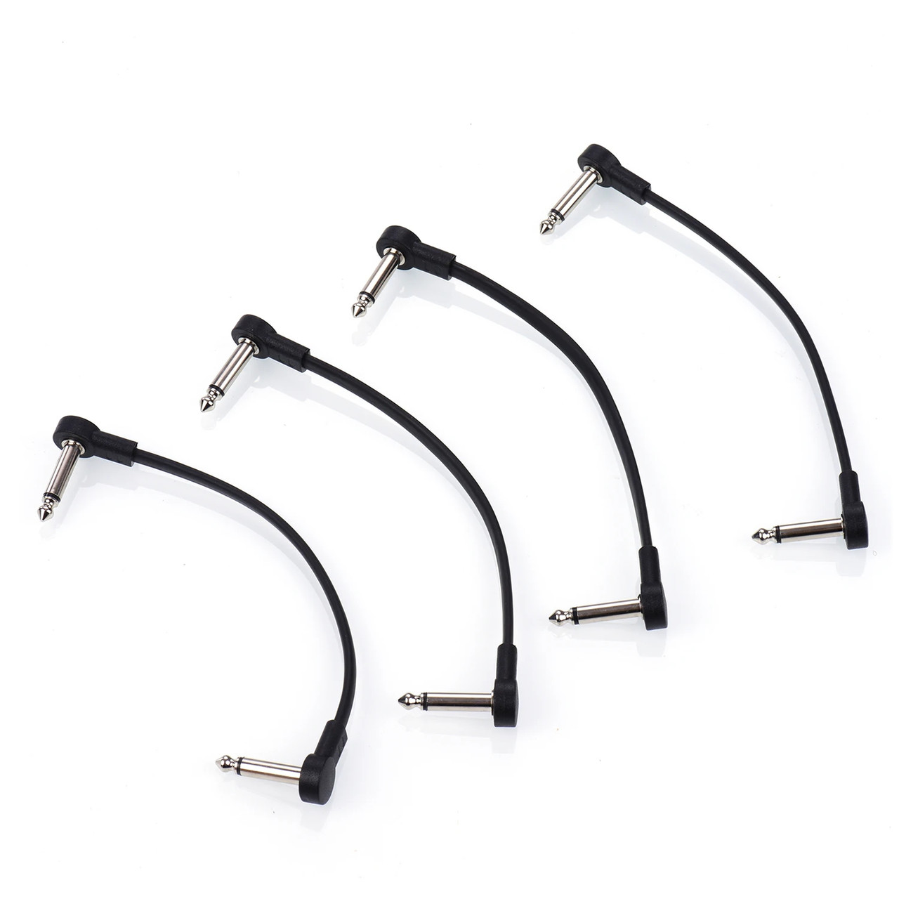 Four black 15cm right-angle guitar pedal patch cables on white background