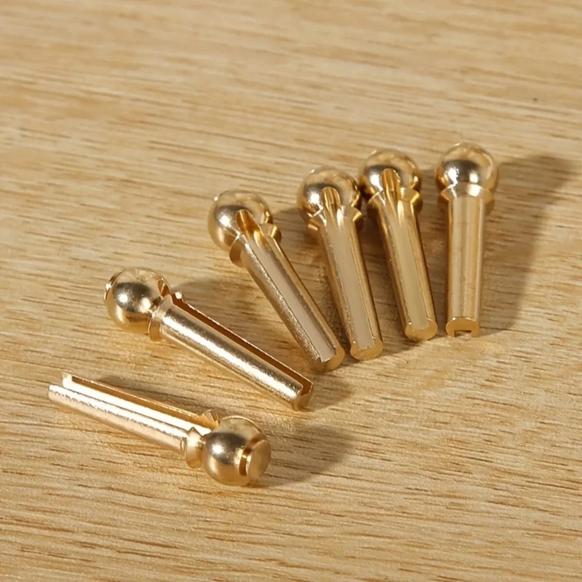 Solid Brass Acoustic Guitar Bridge Pins with Puller – 6 Pack — detail or usage view