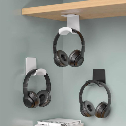 Adhesive headphone hanger mounted under a desk