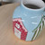 Traditional Beach Hut Vase, Bright Seaside Beach Scene, with nautical Flags.
Small Decorative Flower Jug, Hand painted, Glazed and Fired. Hold fresh, Dried or Artificial Flowers and Leaves