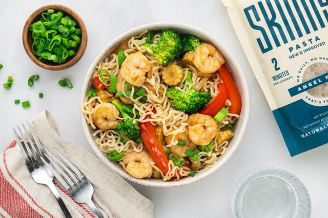 An overhead image of a bowl of shrimp stir fry made with It's Skinny Angel Hair noodles.