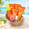Ceramic seashell gift dish with California Mango lotion tubes, lip balm, spray bottle, and flamingo flip-flops.