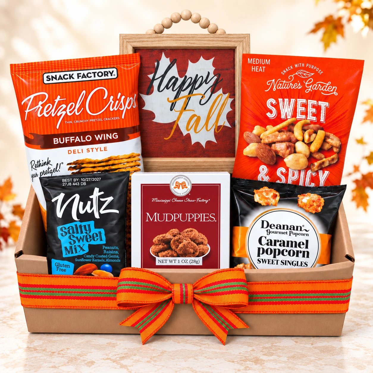 Happy Fall gift basket filled with assorted sweet and savory snacks for Thanksgiving.