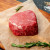 Raw Filet Mignone Boneless Steak over brown parchment paper