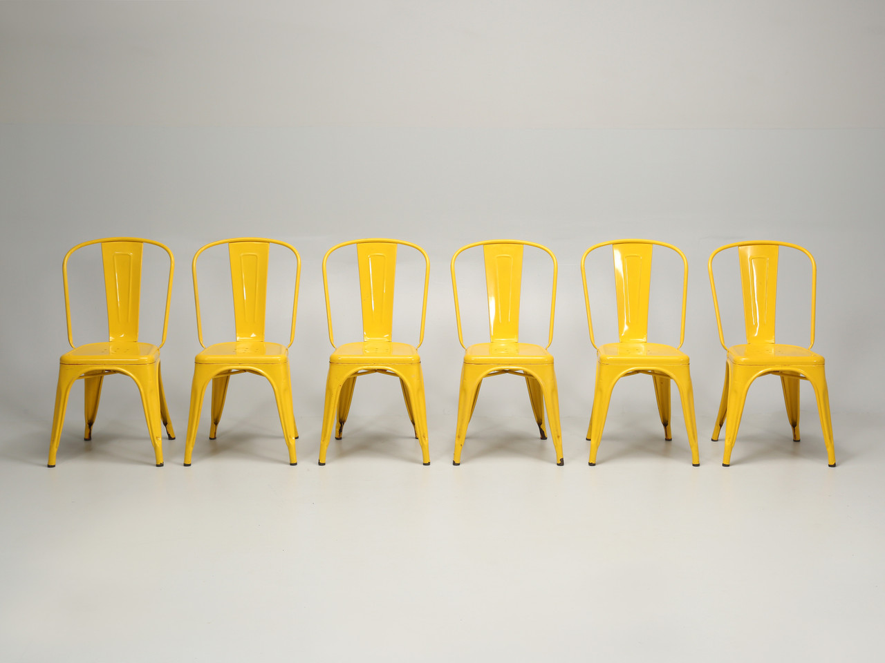 six yellow chairs